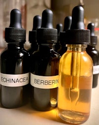 four bottles of cbd oil on a table